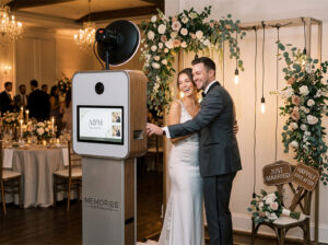 Photo booth vendor at the Rochester Wedding Expo offering fun and personalized photo experiences for weddings and events