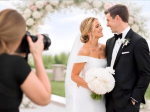 Wedding videographer vendor at the Rochester Wedding Expo offering professional video services for weddings and events